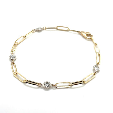 Gold-tone diamond bezel link bracelet with round sparkling stones and clasp