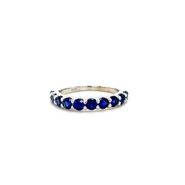 Sapphire ring with royal blue stones in a slim, scalloped band