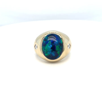 18k yellow gold opal ring with oval blue-green gemstone and diamond side accents