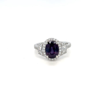 Platinum ring with purple oval alexandrite and diamond cluster halo