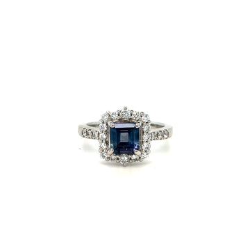 Platinum ring with blue square-cut center gemstone and diamond halo, split shank