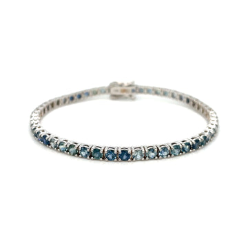 Montana sapphire tennis bracelet in silver-toned metal with blue stone row