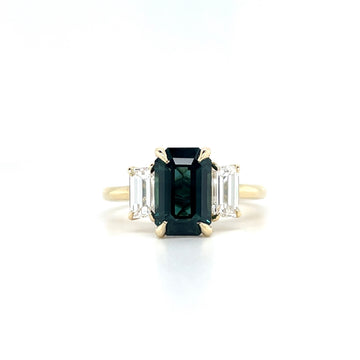 14k yellow gold ring with emerald-cut teal sapphire and baguette diamond sides