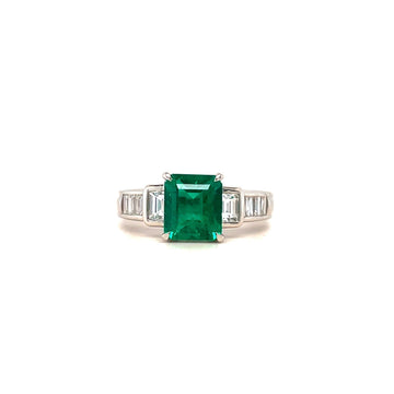 Square green emerald ring with baguette diamond shoulders in white metal