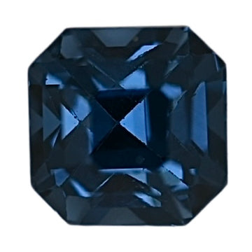 Close-up of dark blue octagonal step-cut spinel gemstone facets