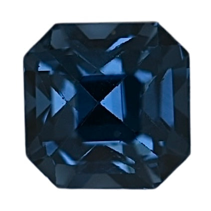Close-up of dark blue octagonal step-cut spinel gemstone facets