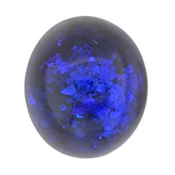 Black opal cabochon with vivid blue iridescent flashes, oval gemstone