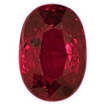 Close-up oval faceted ruby gemstone, deep red