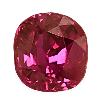 Close-up of oval pink-red faceted ruby gemstone with sparkling facets