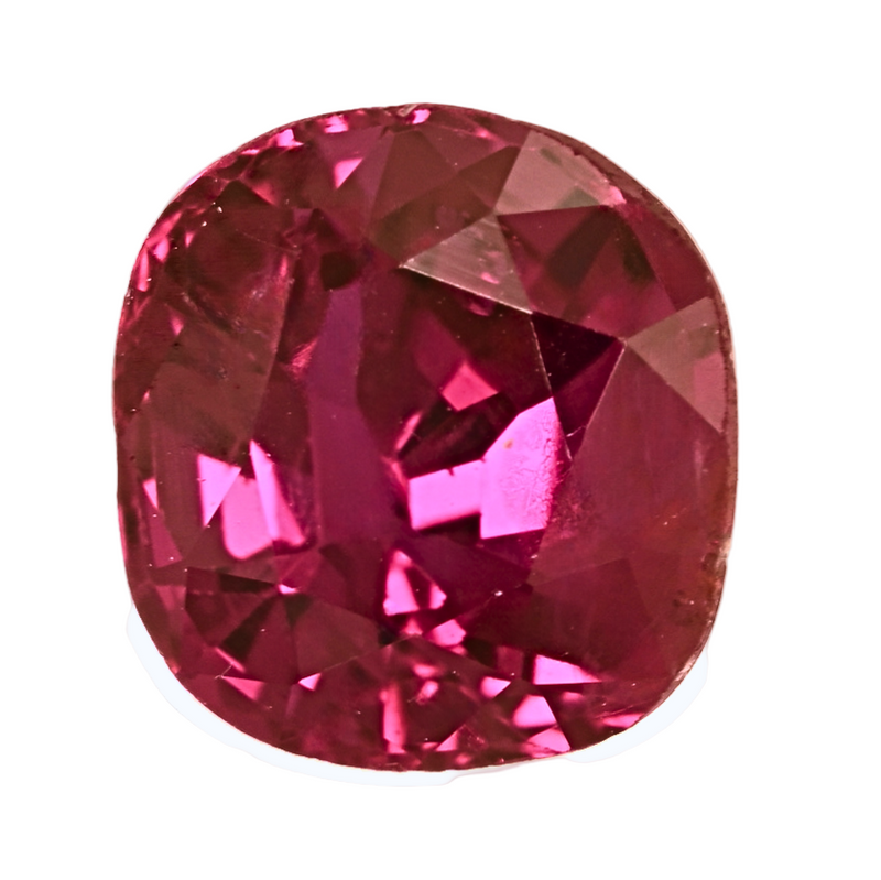 Close-up of oval pink-red faceted ruby gemstone with sparkling facets