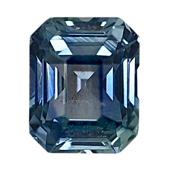 Teal sapphire gemstone, emerald cut with faceted brilliance