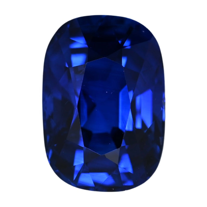 Cushion-cut blue sapphire gemstone, deep royal blue with bright faceted shine