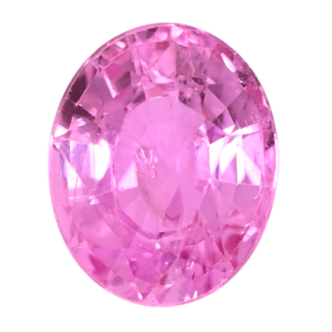Oval pink sapphire gemstone with faceted cut and sparkling surface
