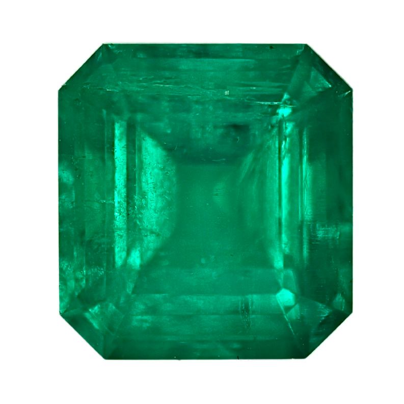 Octagonal emerald gemstone in vivid green with stepped faceted cut