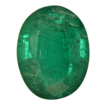 Oval green emerald gemstone, faceted, gemstone close-up