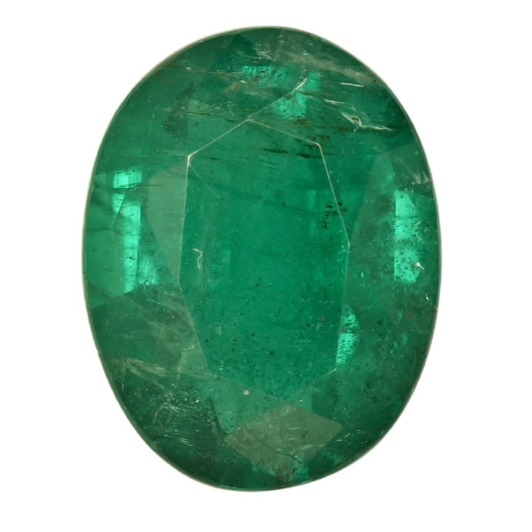 Oval green emerald gemstone, faceted, gemstone close-up