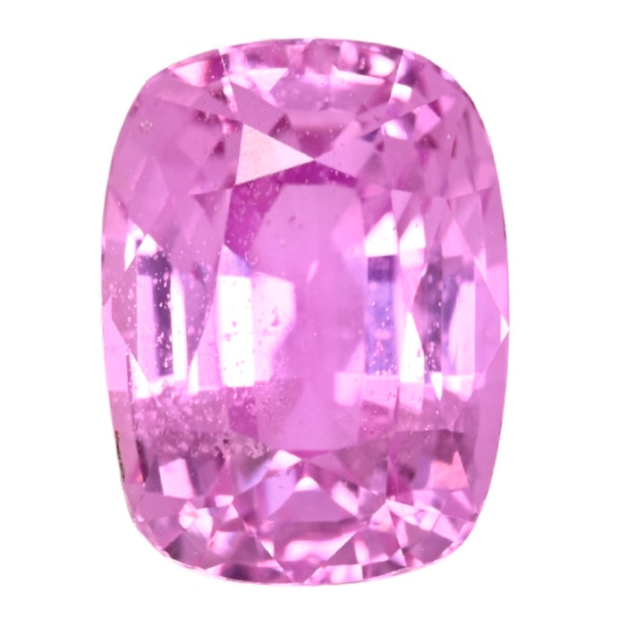 Close-up cushion-cut pink sapphire gemstone, vivid faceting