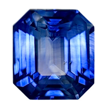 Bi-color sapphire gemstone, emerald-cut with deep blue and light blue facets