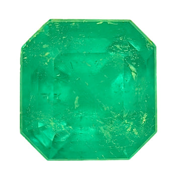 Emerald gemstone, octagonal step-cut, bright green faceted crystal