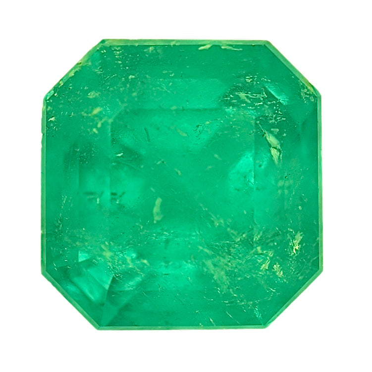 Emerald gemstone, octagonal step-cut, bright green faceted crystal