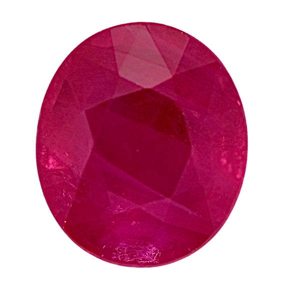 Round ruby gemstone with faceted surface, deep red color