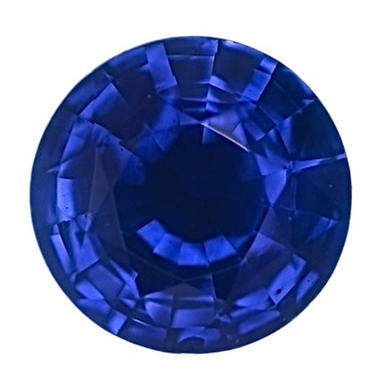 Round blue sapphire gemstone, faceted, vivid deep blue