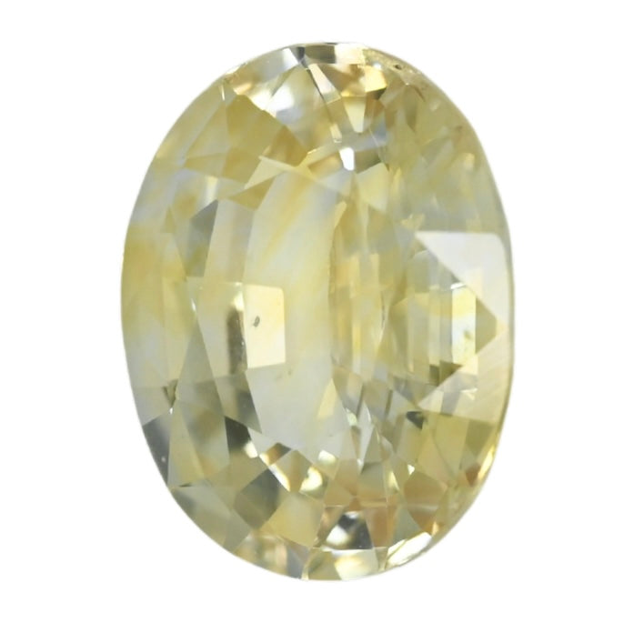Oval yellow sapphire gemstone with faceted cut, polished shine