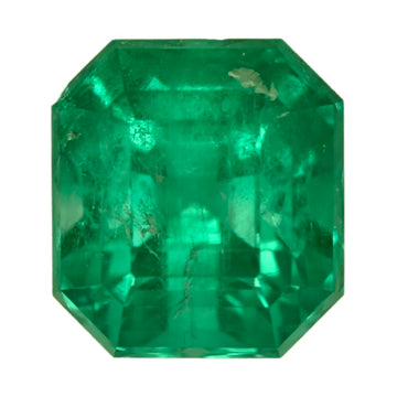 Faceted octagonal green emerald gemstone, close-up