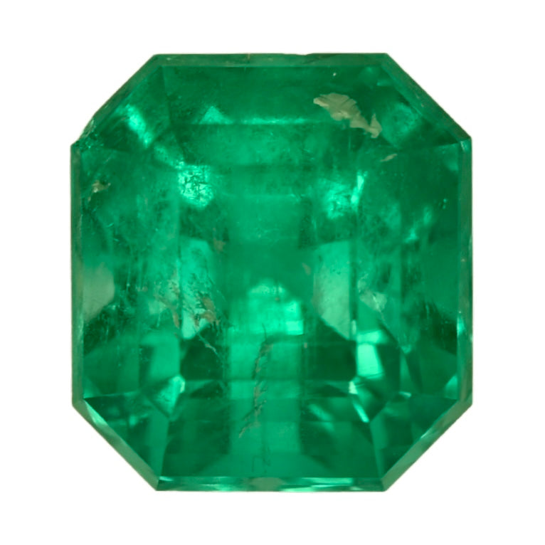 Faceted octagonal green emerald gemstone, close-up
