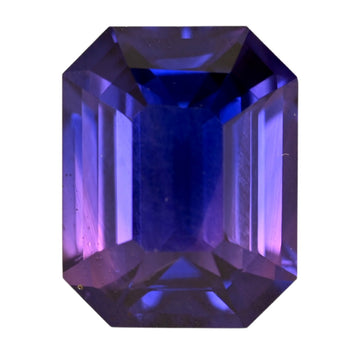 Octagon cut sapphire gemstone with blue-purple tones, polished facets.