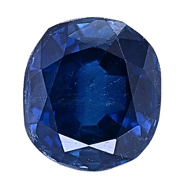 Blue sapphire gemstone close-up, faceted oval cut with deep pavilion