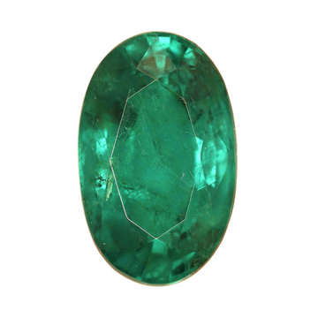 Close-up oval green emerald gemstone, faceted and reflective