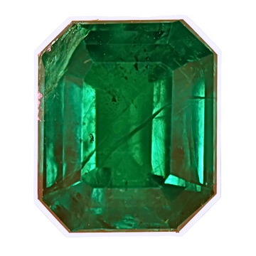 Green emerald-cut gemstone with step facets in a bezel setting