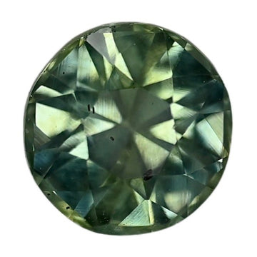 Round faceted sapphire gemstone with a deep green-blue hue