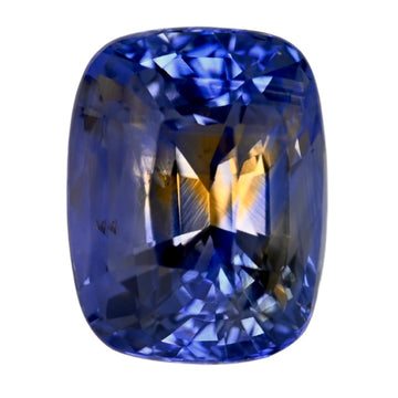 Bi-color sapphire gemstone, cushion-cut, deep blue with yellow flashes