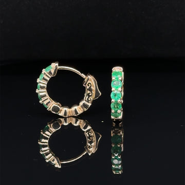 Yellow gold mini hoop earrings with green oval emerald stones, front and side view.