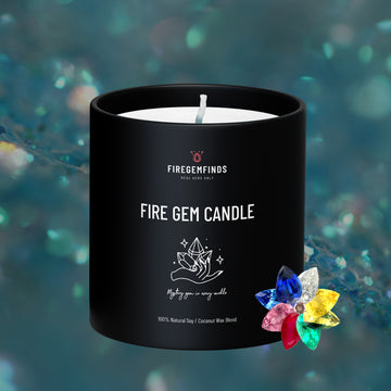 Black jar candle with centered wick, white label, and colorful faceted gem accents