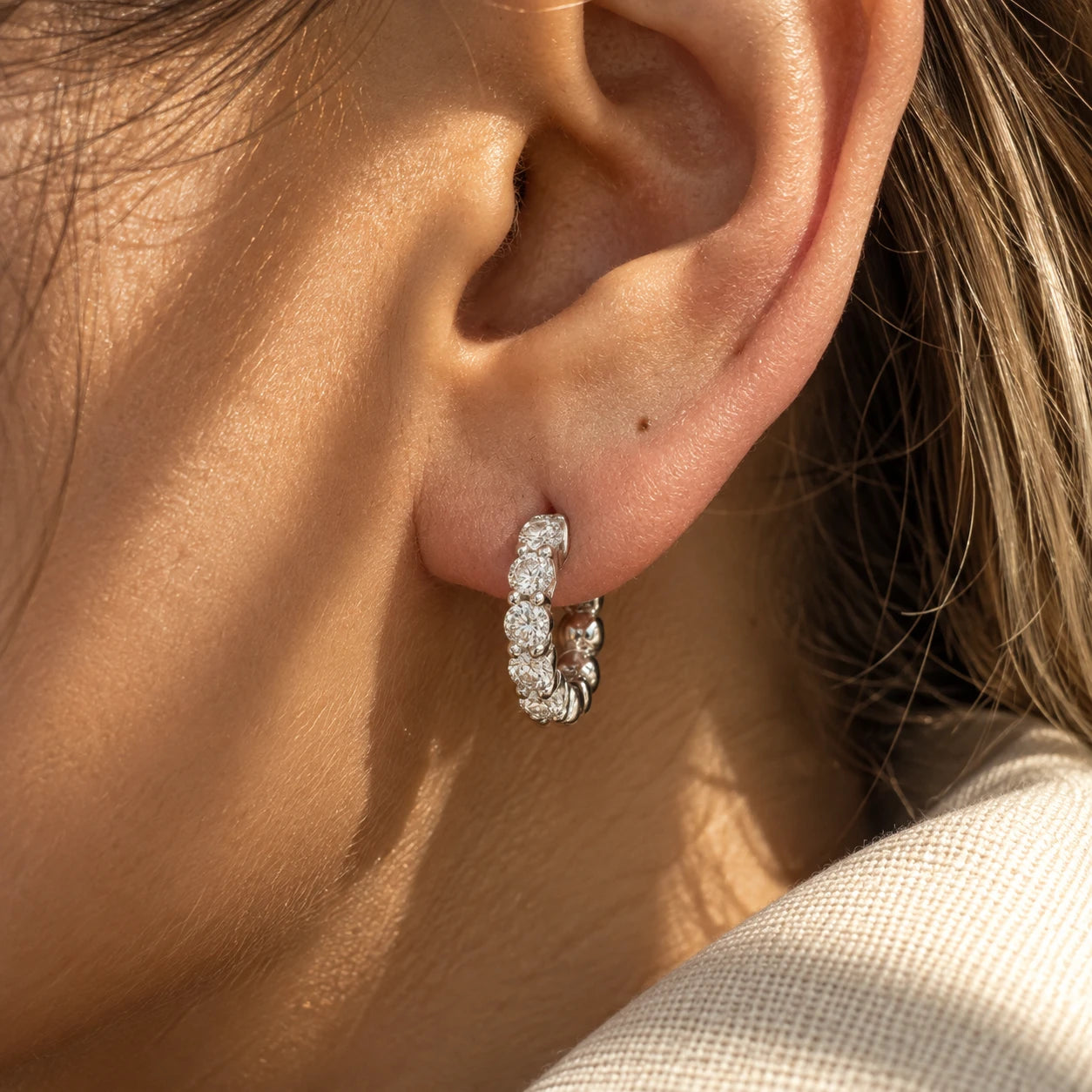 Diamond hoop earring in white gold, worn